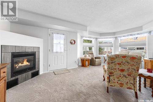 104 65 Hochelaga Street W, Moose Jaw, SK - Indoor Photo Showing Living Room With Fireplace