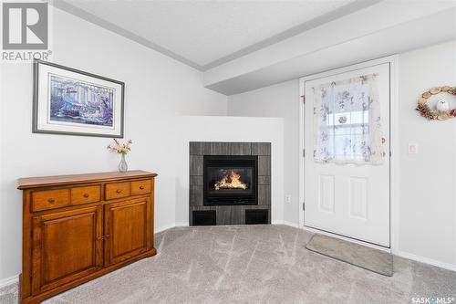 104 65 Hochelaga Street W, Moose Jaw, SK - Indoor Photo Showing Other Room With Fireplace