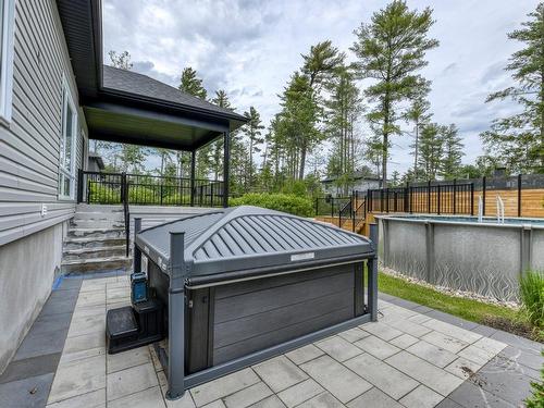 Spa - 16985 Rue Du Zircon, Mirabel, QC - Outdoor With Above Ground Pool With Exterior