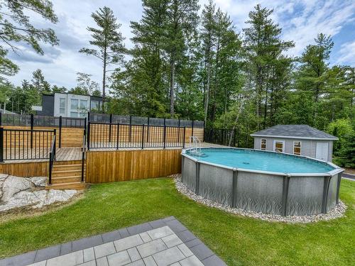 Terrasse - 16985 Rue Du Zircon, Mirabel, QC - Outdoor With Above Ground Pool With Backyard