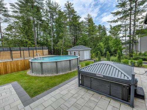 Terrasse - 16985 Rue Du Zircon, Mirabel, QC - Outdoor With Above Ground Pool With Backyard