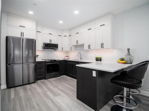 205-4474 Wellington Rd, Nanaimo, BC - Indoor Photo Showing Kitchen With Upgraded Kitchen