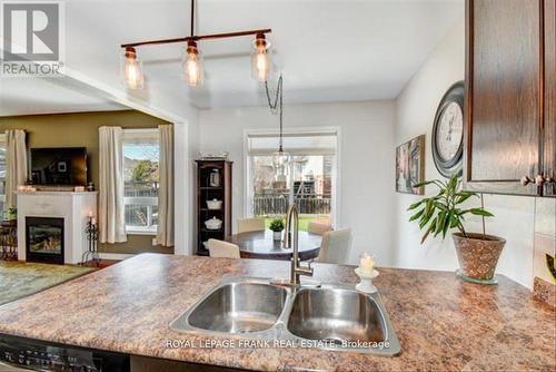 1144 Scollard Drive, Peterborough, ON - Indoor Photo Showing Kitchen With Fireplace With Double Sink