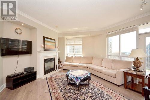 2612 - 25 Kingsbridge Garden Circle, Mississauga, ON - Indoor Photo Showing Living Room With Fireplace