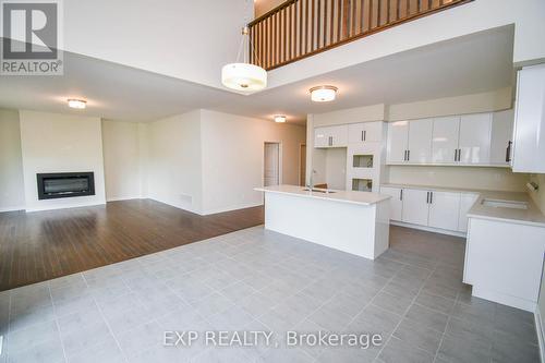 3193 Searidge Street, Severn (West Shore), ON - Indoor Photo Showing Kitchen With Fireplace