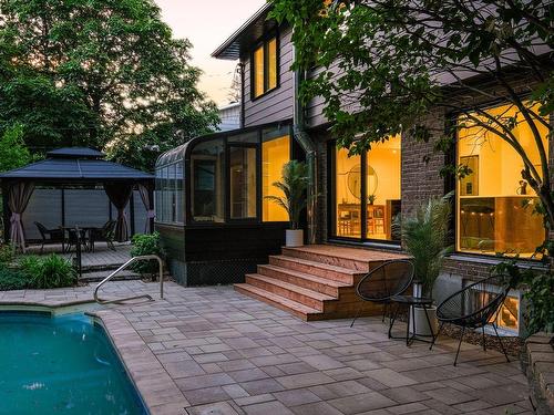 Back facade - 1895 Rue De La Duchesse, Saint-Bruno-De-Montarville, QC - Outdoor With In Ground Pool With Deck Patio Veranda