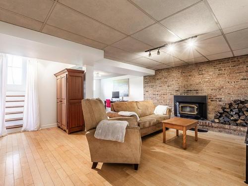 Salle familiale - 1144 Rue Perrot, Saint-Bruno-De-Montarville, QC - Indoor With Fireplace