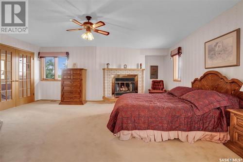 250 Prospect Crescent, Lumsden, SK - Indoor Photo Showing Bedroom With Fireplace