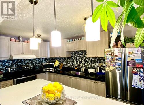 Ph1415 - 10 Tobermory Drive, Toronto (Black Creek), ON - Indoor Photo Showing Kitchen With Double Sink With Upgraded Kitchen