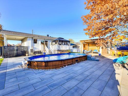 Backyard - 4262 Rue Clément, Terrebonne (Lachenaie), QC - Outdoor With Above Ground Pool