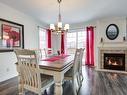 Salle Ã  manger - 202-22 Rue De Bonaventure, Bromont, QC  - Indoor Photo Showing Dining Room With Fireplace 