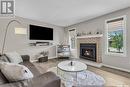 231 Hogg Way, Saskatoon, SK  - Indoor Photo Showing Living Room With Fireplace 