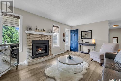231 Hogg Way, Saskatoon, SK - Indoor Photo Showing Living Room With Fireplace