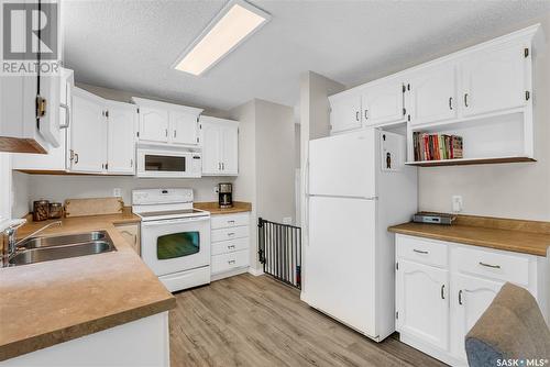 231 Hogg Way, Saskatoon, SK - Indoor Photo Showing Kitchen With Double Sink