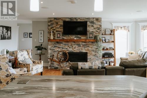 26 Main Street, New Wes Valley, NL - Indoor Photo Showing Living Room With Fireplace