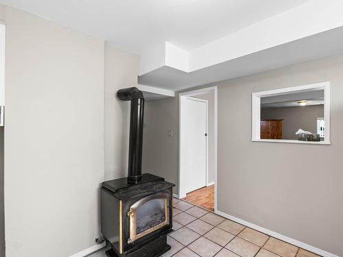 936 Surrey Ave, Kamloops, BC - Indoor Photo Showing Other Room With Fireplace