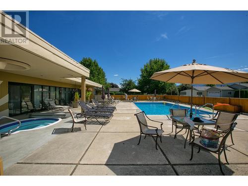 1255 Raymer Avenue Unit# 504, Kelowna, BC - Outdoor With In Ground Pool With Deck Patio Veranda