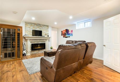 Fourth level family room with your own sauna - 91 Hedge Lawn Drive, Grimsby, ON - Indoor With Fireplace