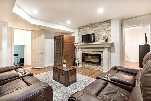 Fourth level family room - 91 Hedge Lawn Drive, Grimsby, ON - Indoor Photo Showing Living Room With Fireplace