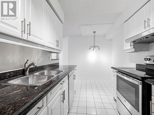 911 - 24 Wellesley Street W, Toronto, ON - Indoor Photo Showing Kitchen With Double Sink