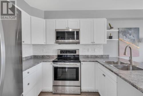 208 - 440 Lonsberry Drive, Cobourg, ON - Indoor Photo Showing Kitchen With Double Sink