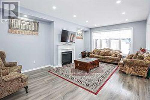 Bsmt - 7977 Hackberry Trail, Niagara Falls, ON - Indoor Photo Showing Living Room With Fireplace
