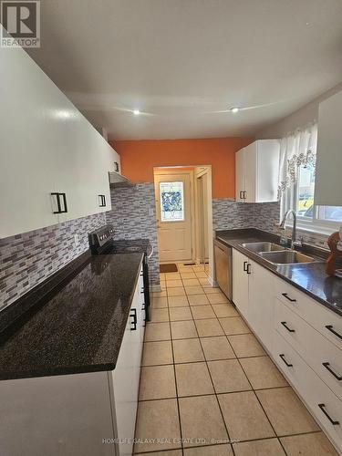 131 Wickson Trail, Toronto, ON - Indoor Photo Showing Kitchen With Double Sink