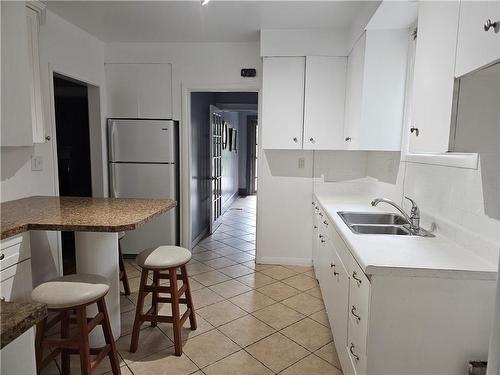 KITCHEN CABINET HAVE BEEN REMOVED - 212 Balmoral Avenue S, Hamilton, ON - Indoor Photo Showing Kitchen With Double Sink