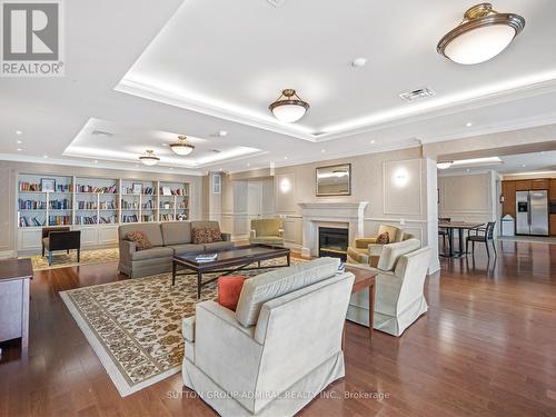 1210 - 2 Clairtrell Road, Toronto, ON - Indoor Photo Showing Living Room With Fireplace