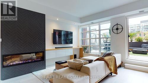 304 - 501 Adelaide Street W, Toronto, ON - Indoor Photo Showing Living Room With Fireplace