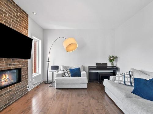 Living room - 1178 Rue Du Clos-Du-Petit-Mont, Prévost, QC - Indoor Photo Showing Living Room With Fireplace