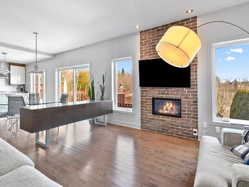 Living room - 1178 Rue Du Clos-Du-Petit-Mont, Prévost, QC - Indoor Photo Showing Living Room With Fireplace