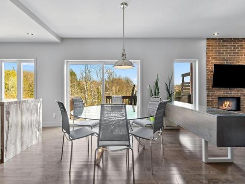 Dining room - 1178 Rue Du Clos-Du-Petit-Mont, Prévost, QC - Indoor Photo Showing Dining Room With Fireplace