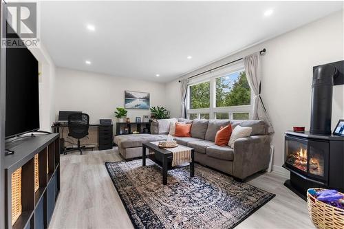 New pot lights - 60 Sebastopol Drive, Foymount, ON - Indoor Photo Showing Living Room With Fireplace