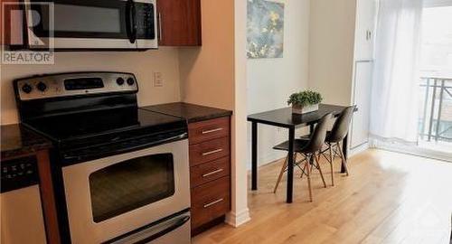 KITCHEN WITH GRANITE COUNTER TOPS - 429 Kent Street Unit#422, Ottawa, ON - Indoor Photo Showing Kitchen