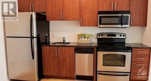 KITCHEN WITH STAINLESS STEEL APPLIANCES - 429 Kent Street Unit#422, Ottawa, ON - Indoor Photo Showing Kitchen With Stainless Steel Kitchen