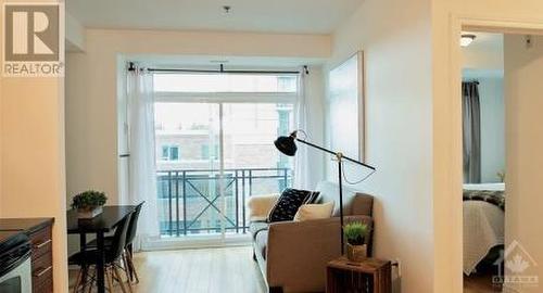 LIVING/DINING ROOM WITH PATIO DOORS TO BALCONY - 429 Kent Street Unit#422, Ottawa, ON - Indoor