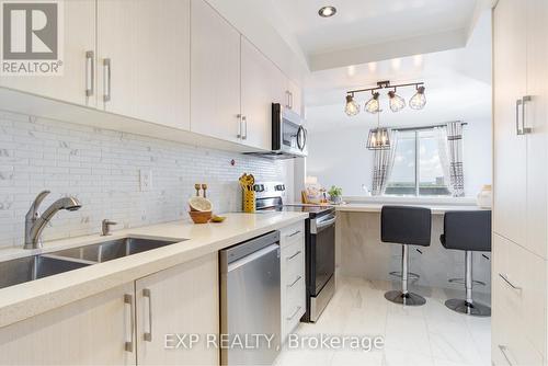 1203 - 3131 Bridletowne Circle, Toronto, ON - Indoor Photo Showing Kitchen With Double Sink With Upgraded Kitchen