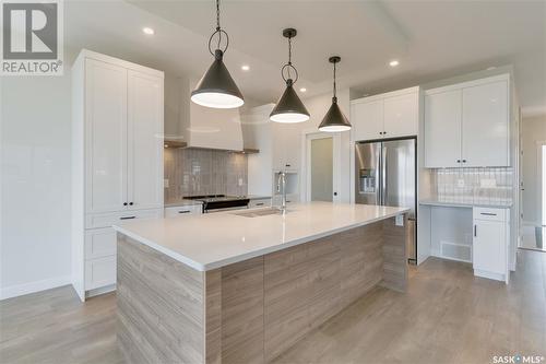 115 Woolf Bend, Saskatoon, SK - Indoor Photo Showing Kitchen With Upgraded Kitchen