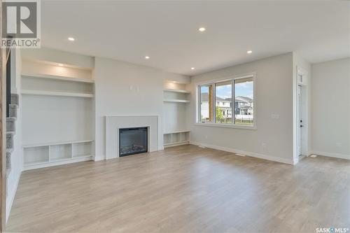 115 Woolf Bend, Saskatoon, SK - Indoor Photo Showing Living Room With Fireplace