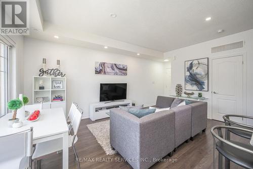 4303 - 2420 Baronwood Drive, Oakville, ON - Indoor Photo Showing Living Room