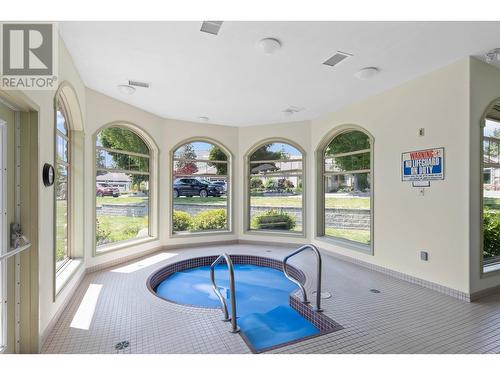 4074 Gellatly Road Unit# 233, West Kelowna, BC - Indoor Photo Showing Other Room With In Ground Pool