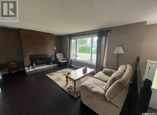 234 Cockburn Crescent, Saskatoon, SK - Indoor Photo Showing Living Room With Fireplace