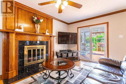 Patio Doors to Deck - 95 Mountainview Crescent, London, ON - Indoor Photo Showing Living Room With Fireplace