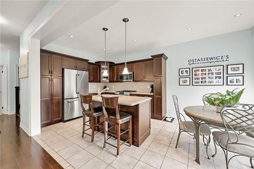 Breakfast bar, quartz countertops and... - 2 Hewitt Drive, Grimsby, ON - Indoor