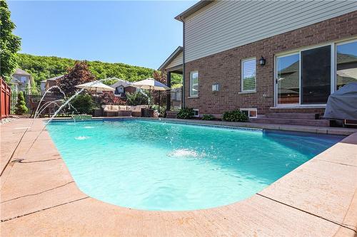 Multiple entertaining areas... - 2 Hewitt Drive, Grimsby, ON - Outdoor With In Ground Pool