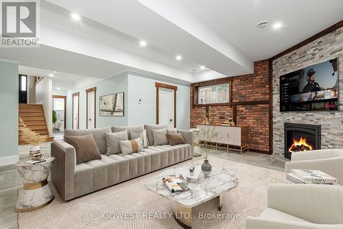 20 Tasker Street, St. Catharines, ON - Indoor Photo Showing Living Room With Fireplace