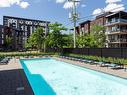 Piscine - 102-11965 Rue D'Amboise, Mirabel, QC  - Outdoor With In Ground Pool 