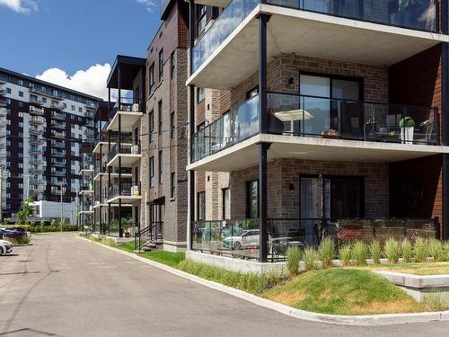 Patio - 102-11965 Rue D'Amboise, Mirabel, QC - Outdoor With Facade