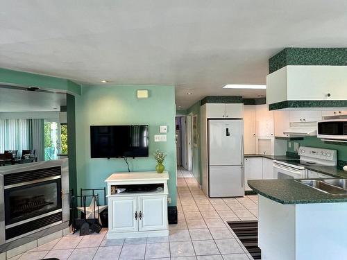 Kitchen - A-51 Domaine-De-La-Belle-Neige, Val-Morin, QC - Indoor Photo Showing Kitchen With Fireplace With Double Sink